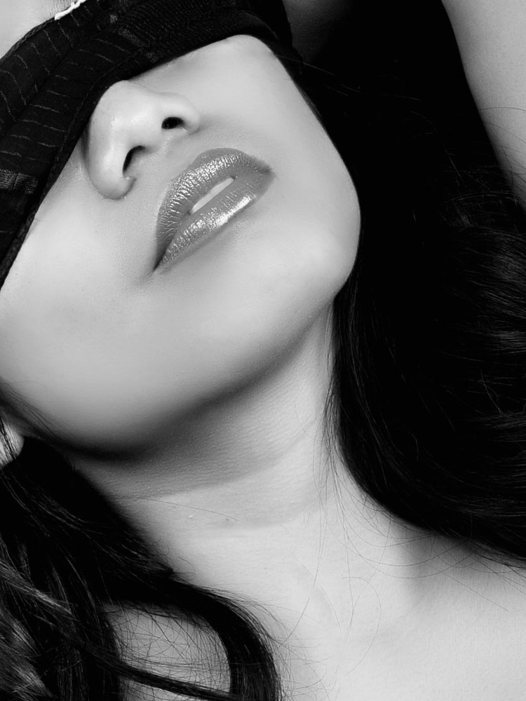 An expressive black and white close-up portrait